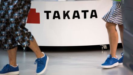 Takata at a car showroom in Tokyo