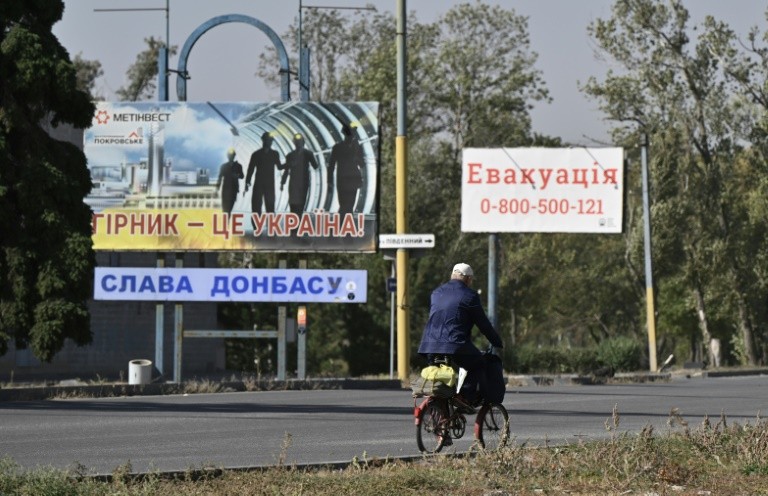In Pokrovsk, posters hailing Ukraine's miners stood next to advice to people evacuating