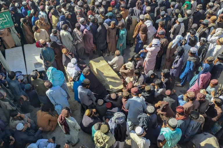 The workers' coffins were laid out in a public square where protesting union and labour group members demanded better protection