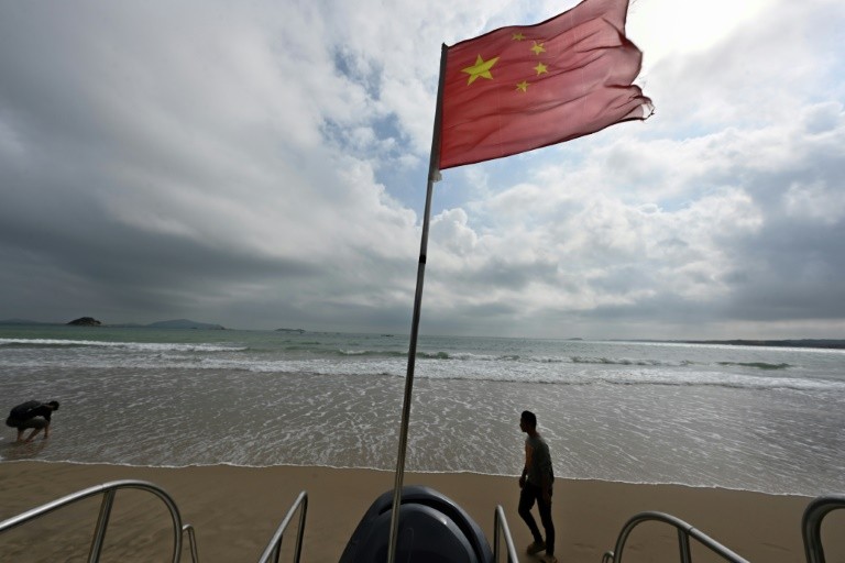 A Chinese flag flutters on a beach on Pingtan island, the closest point in China to Taiwan’s main island
