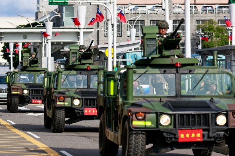 A Taiwan military patrol outside Songshan Airport in Taipei on October 14, when China deployed fighter jets and warships to encircle the self-ruled island during war drills