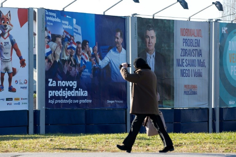 Campaign posters in Zagreb for incumbent Zoran Milanovic, right, and Dragan Primorac, left, of the governing HDZ party