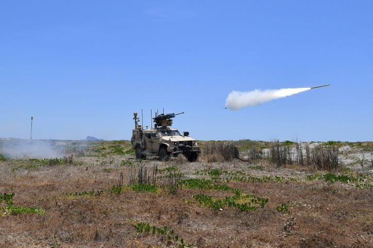 US marines fire MADIS counter drone system during the annual US-Philippines joint military exercise "Balikatan" at a naval training base in San Antonio town on april 27, 2025