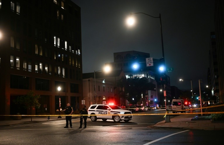 FBI agents cordon off the scene outside the Capital Jewish Museum