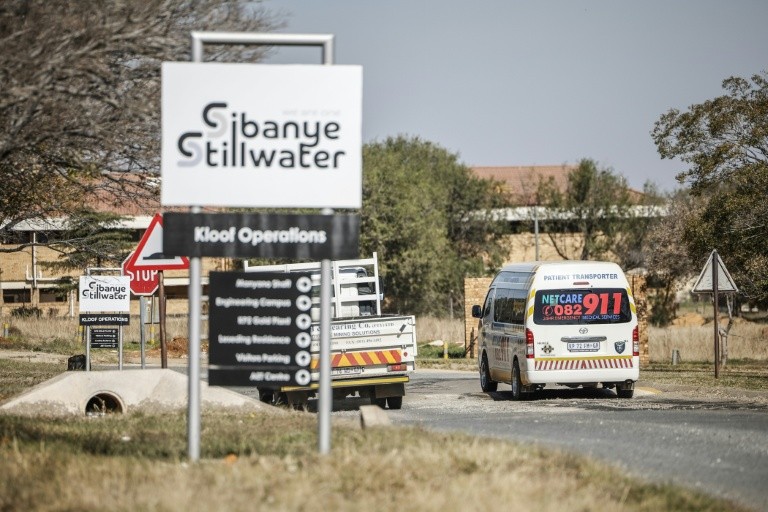 An emergency vehicle arrives at a South African where 260 employees were stuck underground