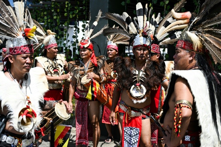 Indigenous Iban men gather during the Gawai Dayak Culture Parade in Kuching