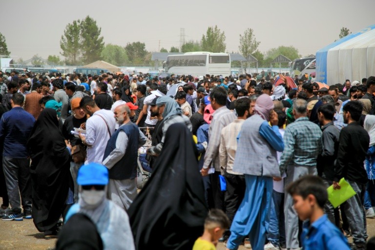 Afghans in their thousands have streamed over the border from Iran at the Islam Qala border point in Afghanistan's Herat province in recent weeks