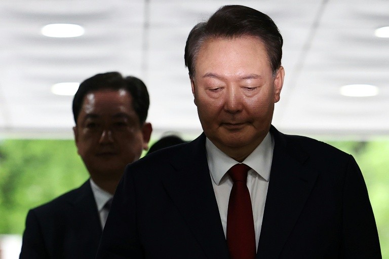 Former president Yoon Suk Yeol arriving at a court hearing in Seoul in early July
