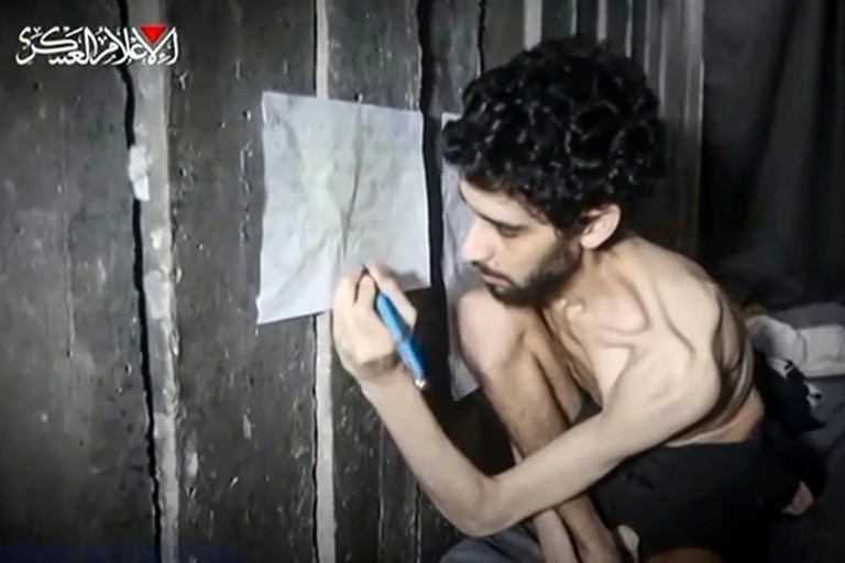 Screengrab from a video released by the armed wing of Palestinian group Hamas showing Israeli hostage Evyatar David in a Gaza tunnel