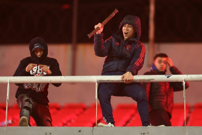 Supporters threw objects and the match was eventually abandoned