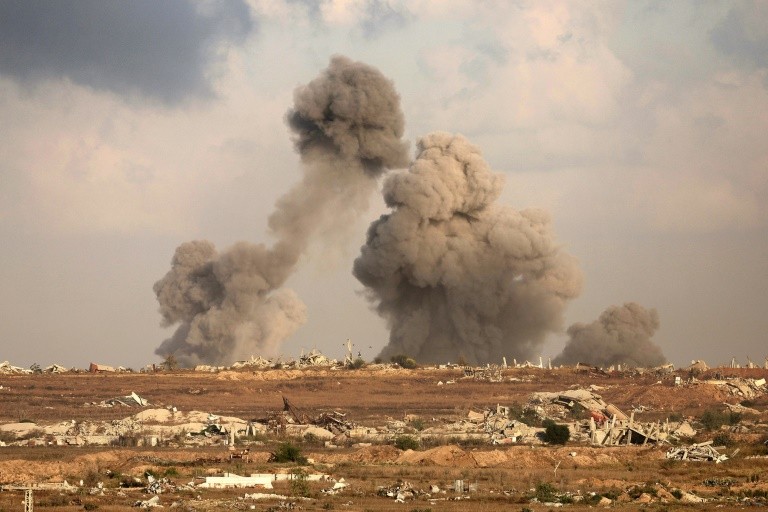 This picture taken from a position at Israel's border with the Gaza Strip shows smoke billowing during Israeli bombardment of the besieged Palestinian territory on September 19, 2025, amid the ongoing war between Israel and the Palestinian Hamas militant