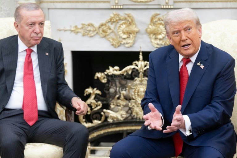 US President Donald Trump speaks to the press a he meets meets with Turkey's President Recep Tayyip Erdogan in the Oval Office of the White House in Washington, DC, on September 25, 2025.