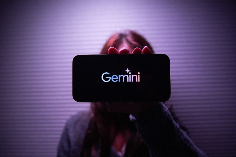 Person holding phone with Gemini logo