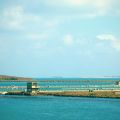 Large Body of Water and a Wind Turbine