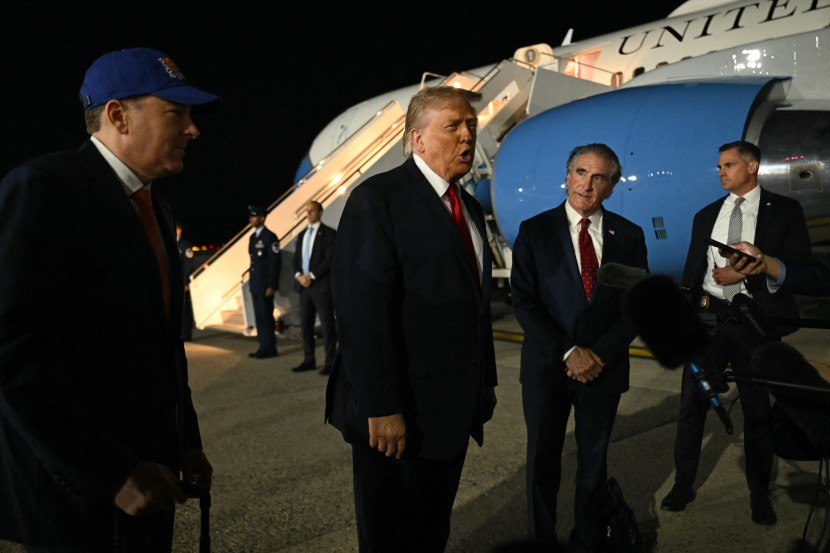 Trump speaks to reporters before boarding Air Force One