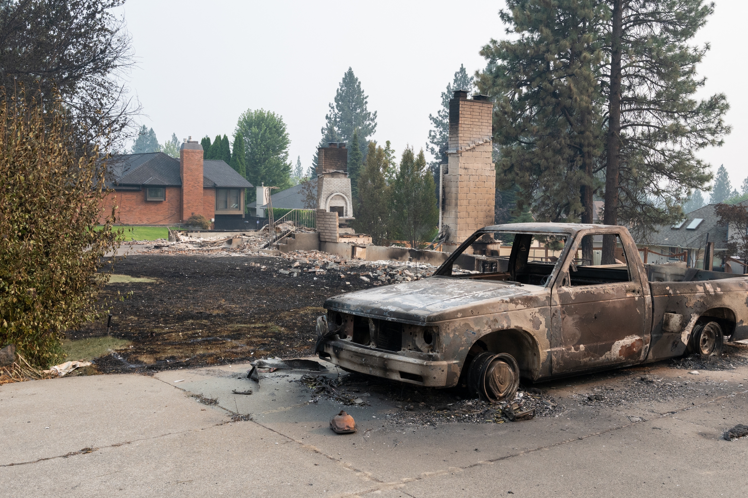 Burned truck and destroyed home in Spokane
