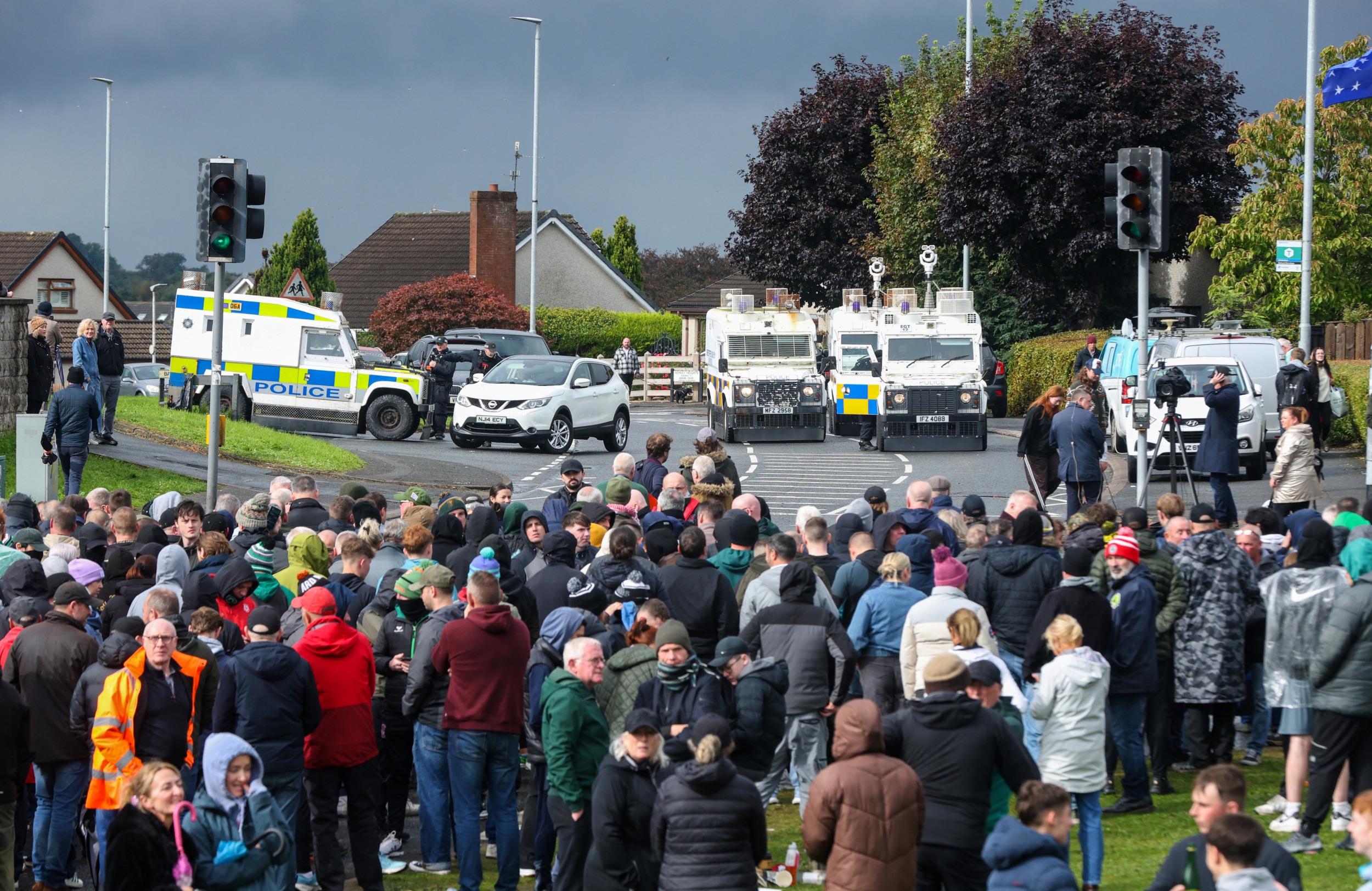 Police Vehicles Face Crowd Blocking Garvaghy Road in Portadown